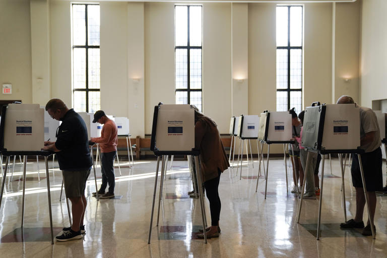 A federal judge has upheld as constitutional provisions of the sweeping election law that Ohio put in place last year, rejecting a Democratic law firm's challenge to strict new photo ID requirements, drop box restrictions and tightened deadlines related to absentee and provisional ballots.