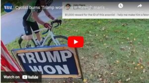 Cyclist Burns Trump flag